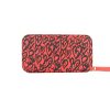 Tangerine Heart Wallet made from vinyl with a canvas interior, and has space for 8 cards