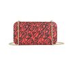 Tangerine Heart Wallet made from vinyl with a canvas interior, and has space for 8 cards