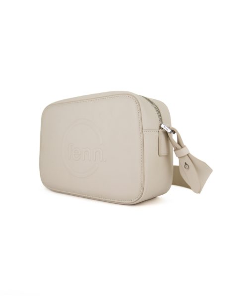 White Sling Bag with an outside zip and inside pouch, it's water resistant and has an adjustable strap