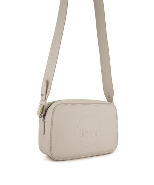White Sling Bag with an outside zip and inside pouch, it's water resistant and has an adjustable strap