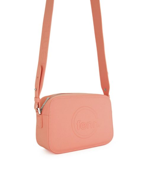 Salmon Sling Bag with an outside zip and inside pouch, it's water resistant and has an adjustable strap