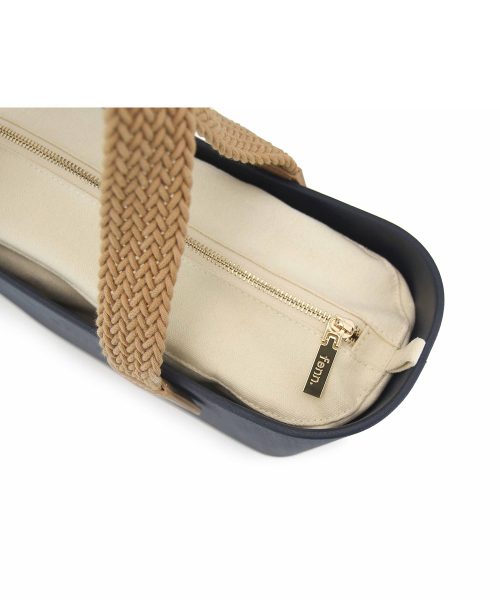 This Navy Tote Bag features a stunning vinyl exterior that exudes sophistication while the handles and inners are interchangeable