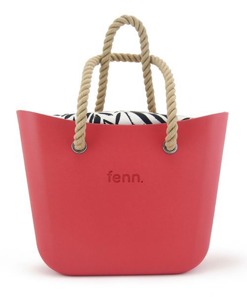 This Red Tote Bag features a stunning vinyl exterior that exudes sophistication while the handles and inners are interchangeable