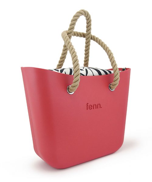 This Red Tote Bag features a stunning vinyl exterior that exudes sophistication while the handles and inners are interchangeable