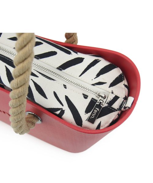 This Red Tote Bag features a stunning vinyl exterior that exudes sophistication while the handles and inners are interchangeable