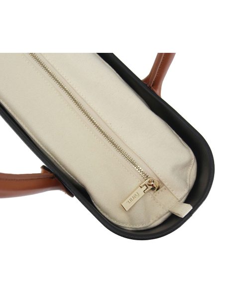 This Black Tote Bag features a stunning vinyl exterior that exudes sophistication while the handles and inners are interchangeable