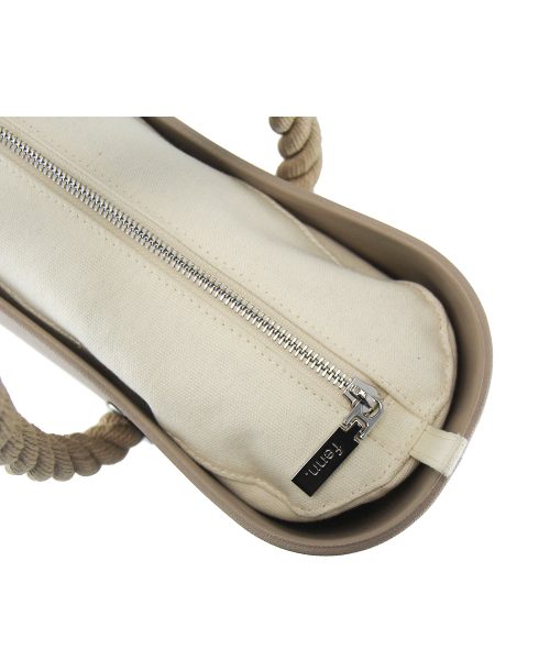 This Stone Tote Bag features a stunning vinyl exterior that exudes sophistication while the handles and inners are interchangeable