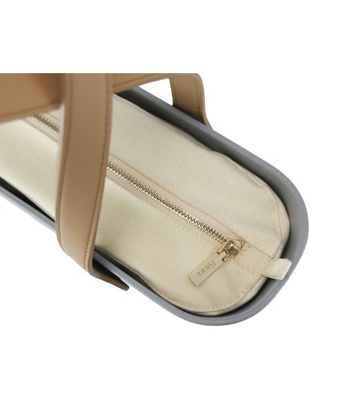 This Blue Haze Tote Bag features a stunning vinyl exterior that exudes sophistication while the handles and inners are interchangeable