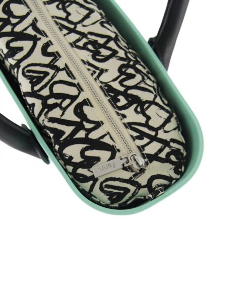 This Turquoise Tote Bag features a stunning vinyl exterior that exudes sophistication while the handles and inners are interchangeable