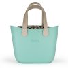 This Turquoise Tote Bag features a stunning vinyl exterior that exudes sophistication while the handles and inners are interchangeable