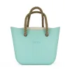 This Turquoise Tote Bag features a stunning vinyl exterior that exudes sophistication while the handles and inners are interchangeable
