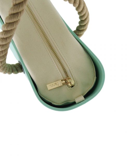 This Turquoise Tote Bag features a stunning vinyl exterior that exudes sophistication while the handles and inners are interchangeable