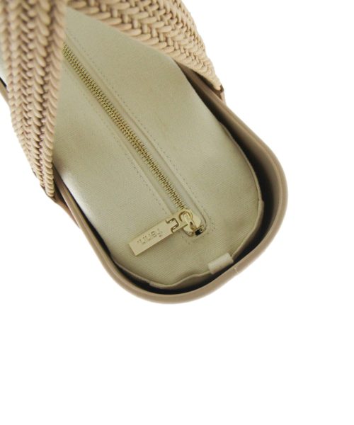 This Sand Tote Bag features a stunning vinyl exterior that exudes sophistication while the handles and inners are interchangeable
