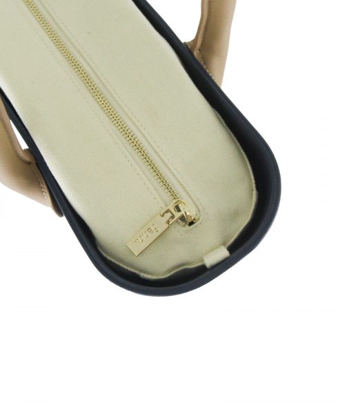 This Navy Tote Bag features a stunning vinyl exterior that exudes sophistication while the handles and inners are interchangeable