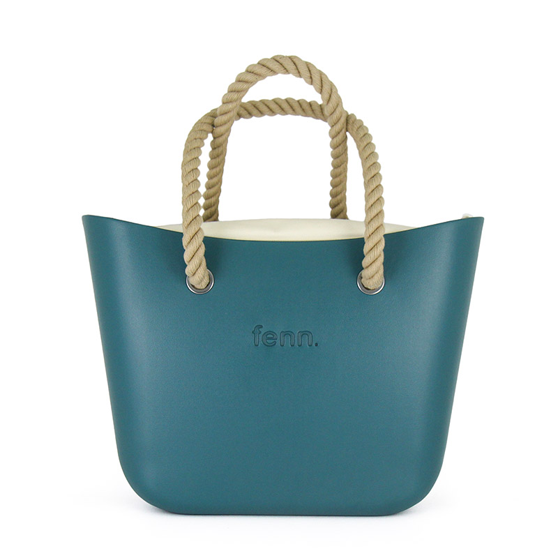 1157-1 This Teal Tote Bag features a stunning vinyl exterior that exudes sophistication while the handles and inners are interchangeable