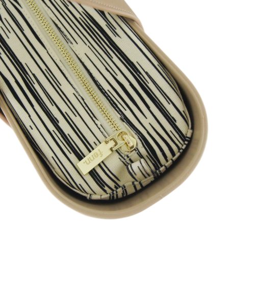 This Sand Tote Bag features a stunning vinyl exterior that exudes sophistication while the handles and inners are interchangeable
