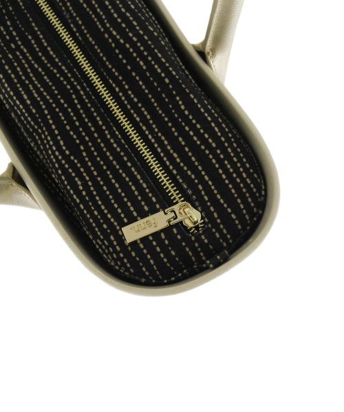 This Champagne Tote Bag features a stunning vinyl exterior that exudes sophistication while the handles and inners are interchangeable