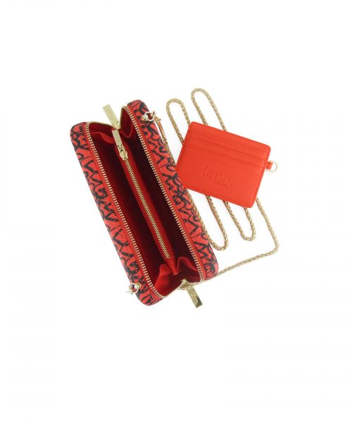 Tangerine Heart Wallet made from vinyl with a canvas interior, and has space for 8 cards